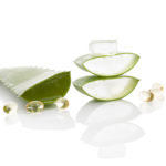 Aloe vera gel caps. Aloe vera sliced leaf and aloe vera gel caps isolated on white background.