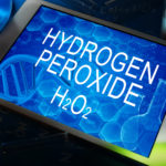 the chemical formula of hydrogen peroxide on a tablet with test tubes