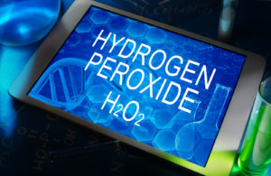 the chemical formula of hydrogen peroxide on a tablet with test tubes